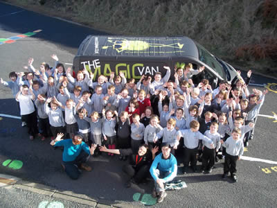 Magic Van in Islay with large group of school pupils in front.